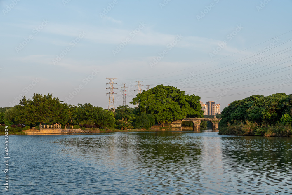 Fototapeta premium Ancient bridges and forests on the river at dusk.