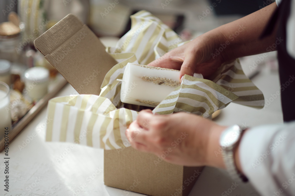 Obraz premium small business owner, online marketing packaging box and delivery. A parcel wrapped in brown paper. Delivery concept for private companies delivery with care. Craft present box