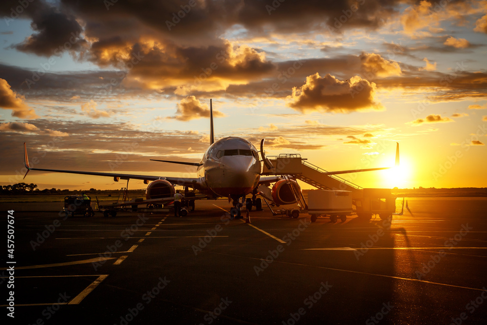 Commercial airplane in an airport before people boarding Commercial airplane in an airport before people boarding