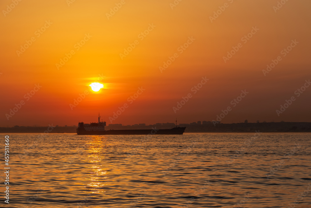 Cargo ship in the Bosporus on a sunset. Istanbul Cargo ship in the Bosporus on a sunset. Istanbul