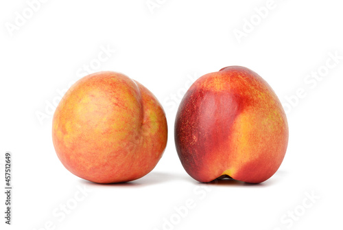 ripe round red nectarine isolated on white background, tasty and healthy fruit, close up