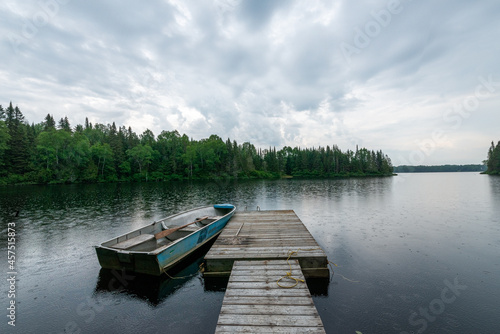 dock on peaceful lake in the morning -