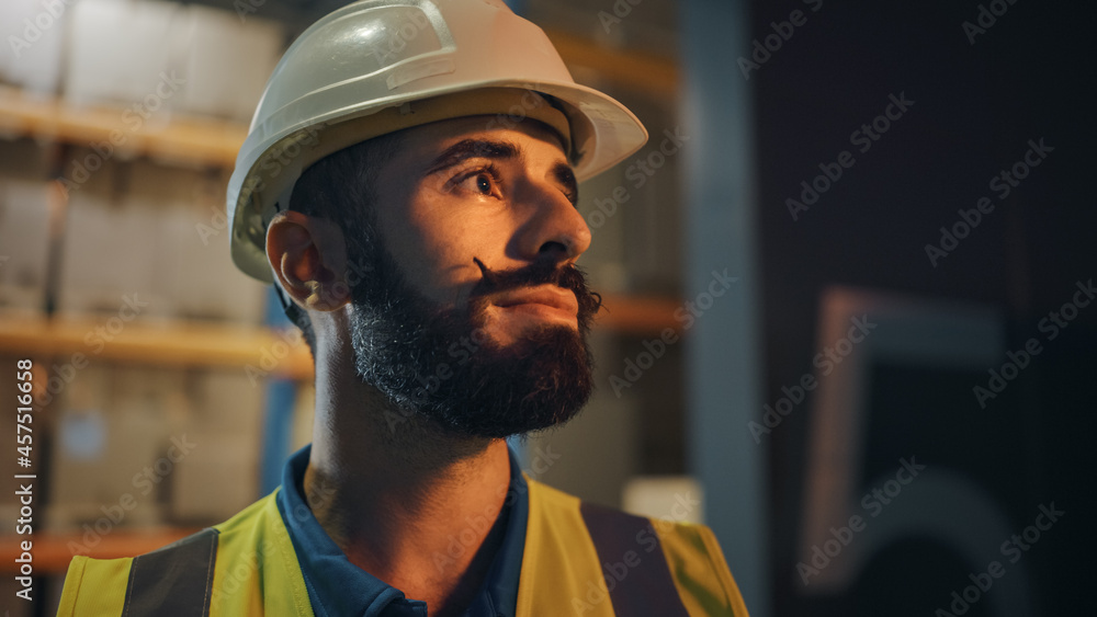 Portrait of Latin Male Worker Wearing Hard Hat Standing Outside of Warehouse Smiling. Professional Frontline Hero Wearing Stylish Beard Standing in Cinematic Light Portrait of Latin Male Worker Wearing Hard Hat Standing Outside of Warehouse Smiling. Professional Frontline Hero Wearing Stylish Beard Standing in Cinematic Light