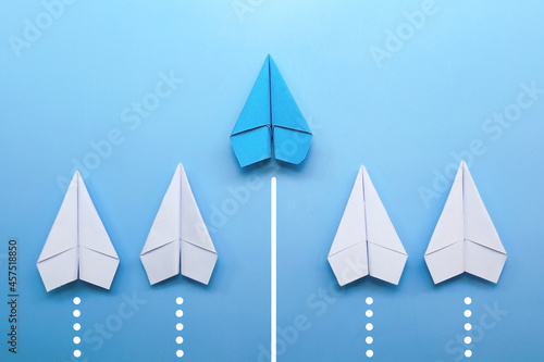 blue paper plane is leadership among white paper plane