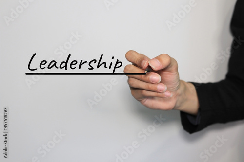 hand writing leadership letters on virtual screen