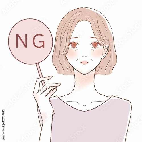 NGサインを出す中年女性