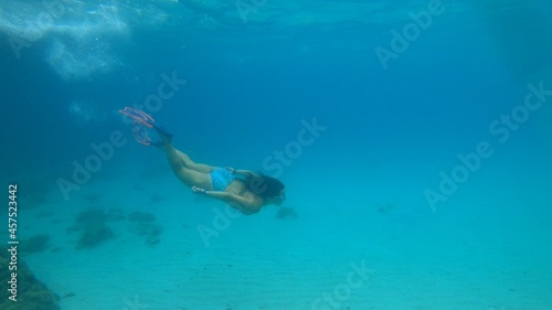 young woman snorkeling in Menorca