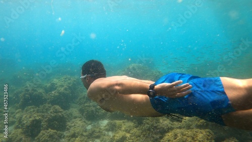 young man snorkeling in Menorca