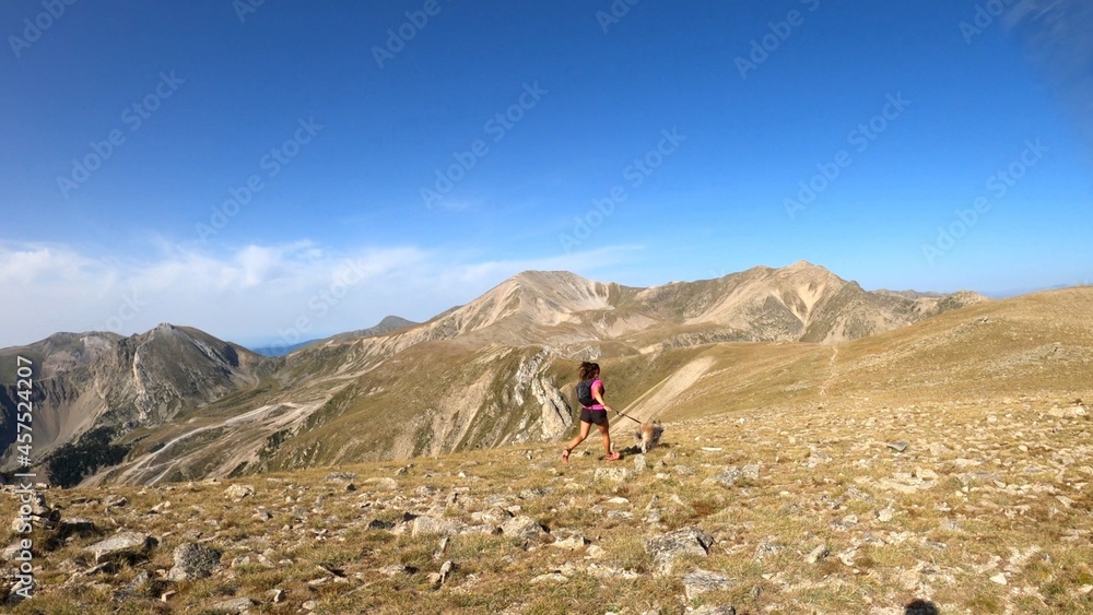 young woman hiking in the mountains