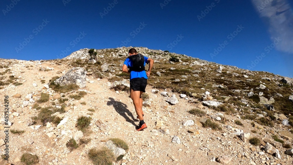 young man hiking in the mountains