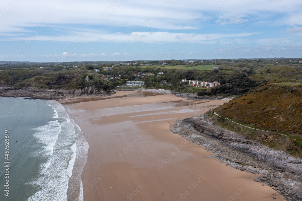 The huge surfing beach of Caswell Bay, on the South Wales Coast Path, at low tide