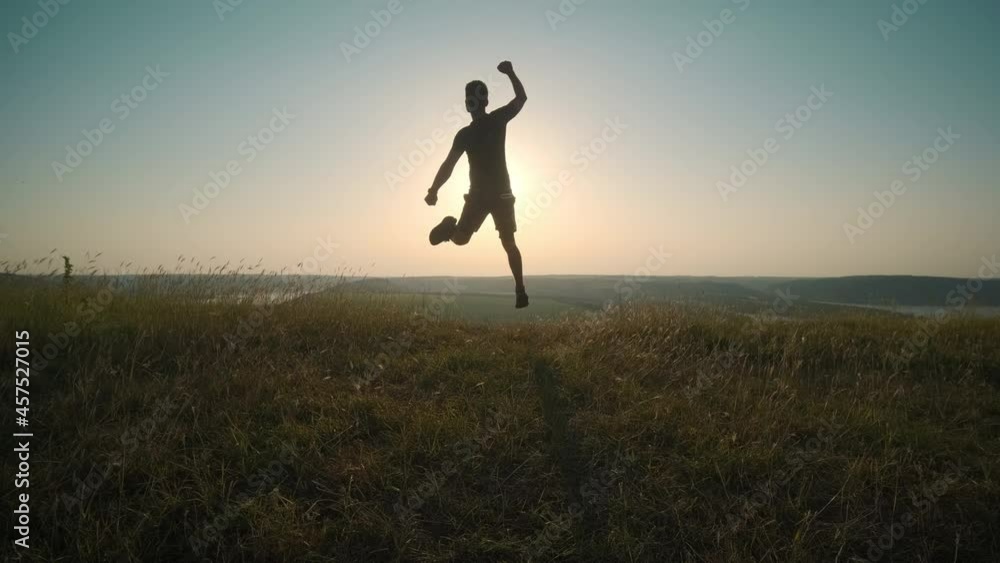 The handsome man running on scenic river background. slow motion The handsome man running on scenic river background. slow motion
