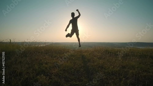 Wallpaper Mural The handsome man running on scenic river background. slow motion Torontodigital.ca