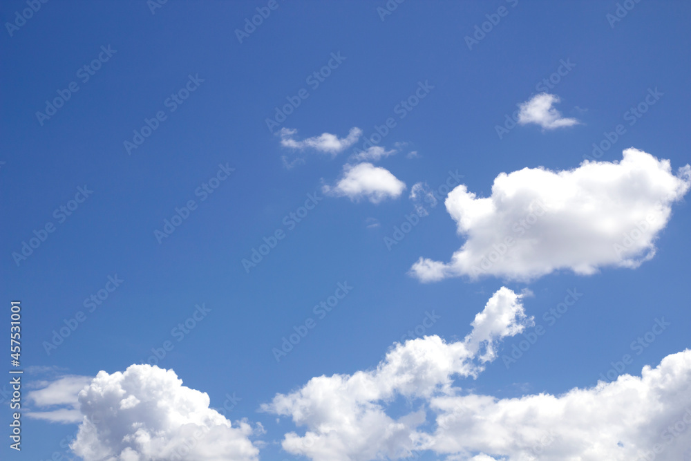 Naklejka premium blue sky background with tiny clouds.