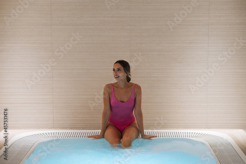 Woman in hot tub in spa
