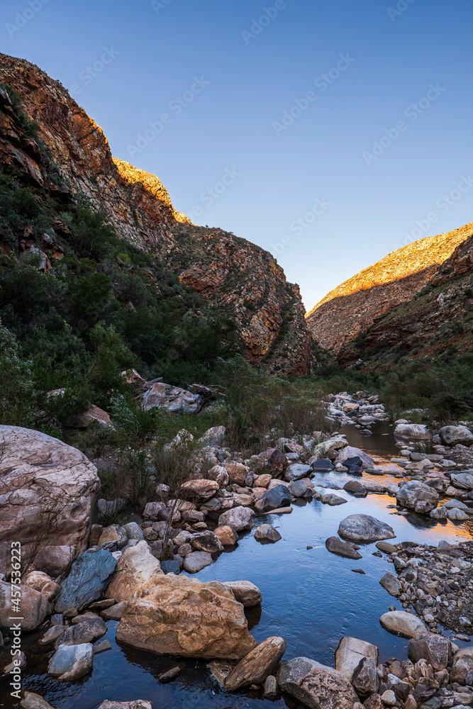 River flows alongside scenic route 62 through beautiful mountains in western cape South Africa