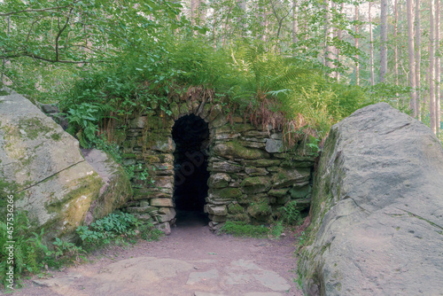 The entrance to Ossian's Cave at the Hermitage (woodland walking area) located near Dunkeld, Perthshire, Scotland.  The cave is a Georgian Folly.
