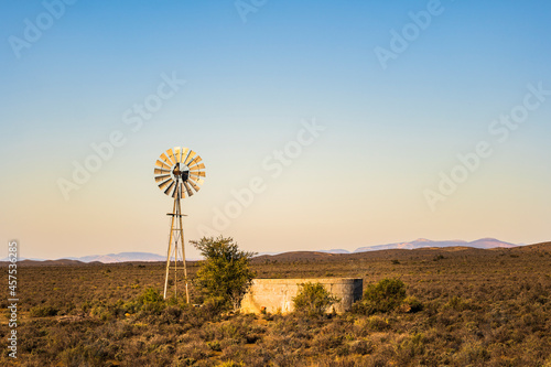 Windmill alongside scenic route 62 through beautiful countrysides, rolling hills in western cape South Africa