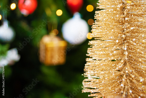 golden tree, bokeh, background, toys, merry christmas, happy new year. 2022. Lights, sparkles and glare. christmas tree