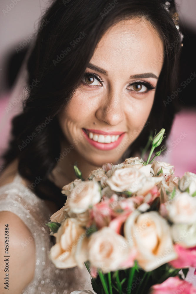 Bride holding big and beautiful wedding bouquet with flowers Bride holding big and beautiful wedding bouquet with flowers