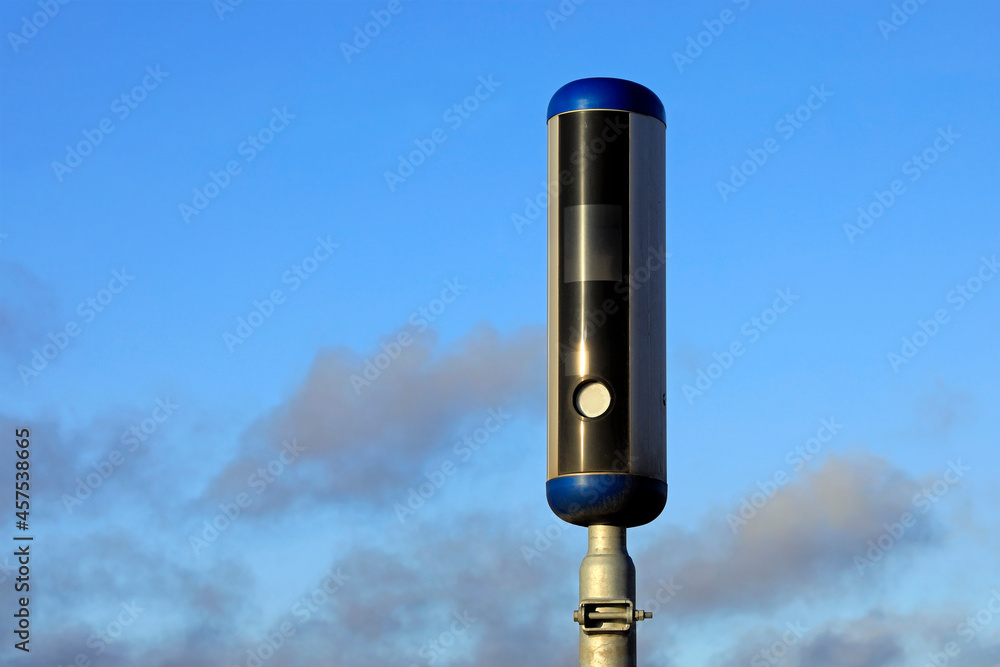 Modern Roadside Speed Camera with Blue Sky Clouds Background, Detail, Copy Space Left of Image. Modern Roadside Speed Camera with Blue Sky Clouds Background, Detail, Copy Space Left of Image.