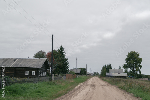 An old Russian traditional village. Rustic landscapes on a cloudy autumn day. Arkhangelsk Region, Russia.