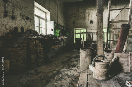 Abandoned stone work building with natural decay a lost place with retro interior decoration © mindscapephotos