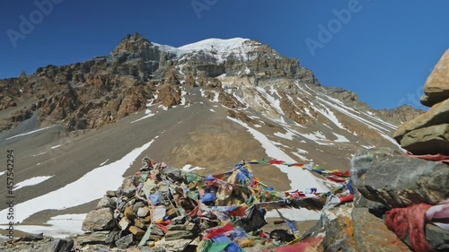 Snowy Yakawa Kang mountain towering at blue sky above Thorong La pass, Nepal, Annapurna Circuit photo