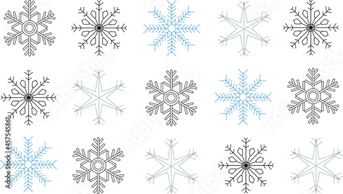 Black, blue and grey snowflakes covering enter frame, on top of white background. Snowflakes in straight lines. Winter, seasonal, holidays.