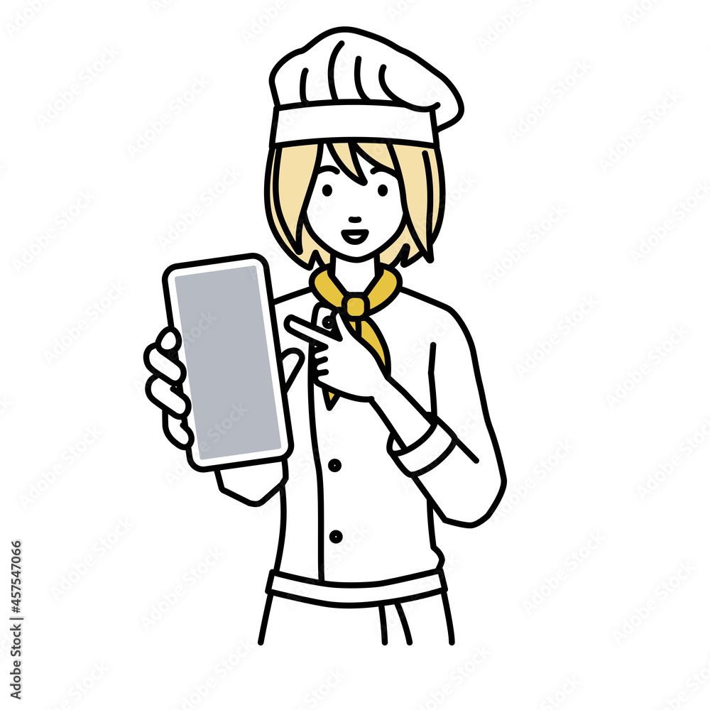 立ってスマートフォンを指差してこちらに向けて見せている調理師の女性 立ってスマートフォンを指差してこちらに向けて見せている調理師の女性