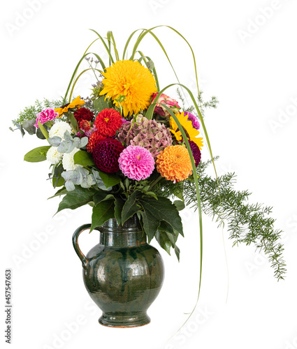 Baroque bouquet of flowers in earthenware jug.