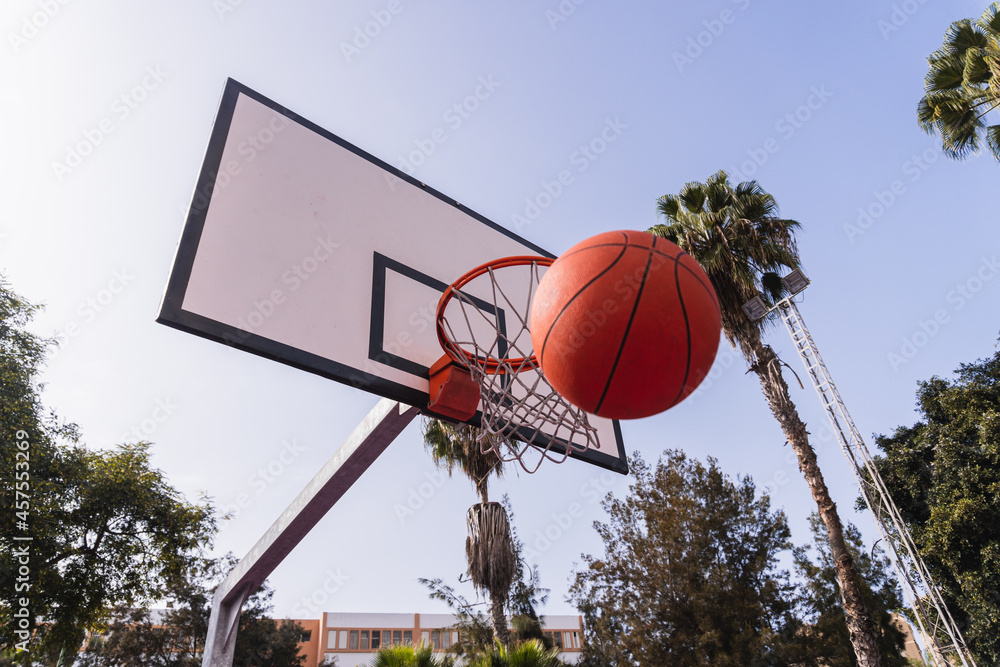 Basket and basketball from below. Basketball concept