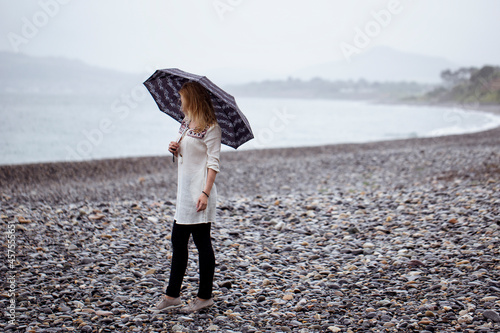 Woman walking on the beach
