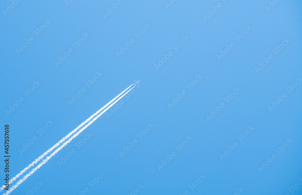 airplane flying high in the blue sky airplane flying high in the blue sky