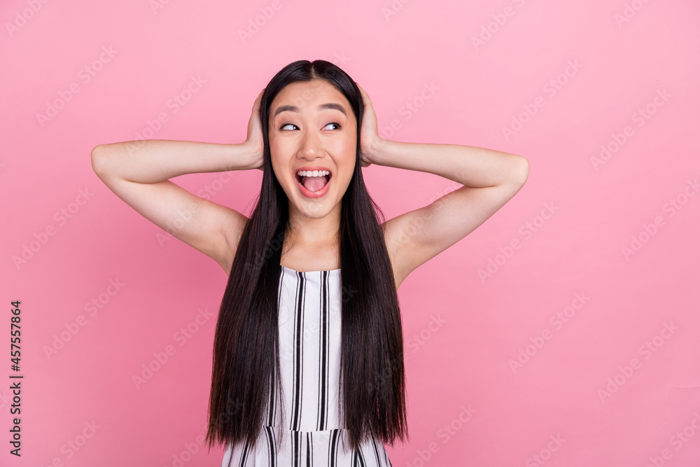 Photo of millennial funky brunette lady close ears look empty space wear white overall isolated on pink color background Photo of millennial funky brunette lady close ears look empty space wear white overall isolated on pink color background