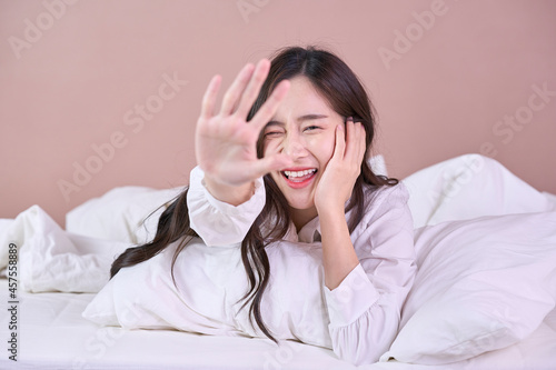 funny and cute woman happy on bed