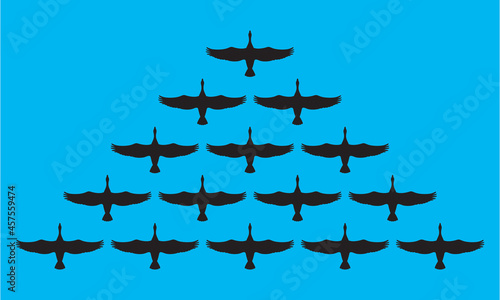 Flock of migrating geese flying in vee formation.
Vector illustration of birds following their leader. Great for nature or business leadership concepts.
