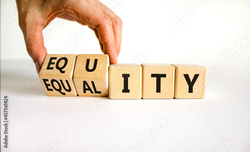 Equity and equality symbol. Businessman turns wooden cubes and changes the word 'equality' to 'equity'. Beautiful white background. Business, equity and equality concept. Copy space.
