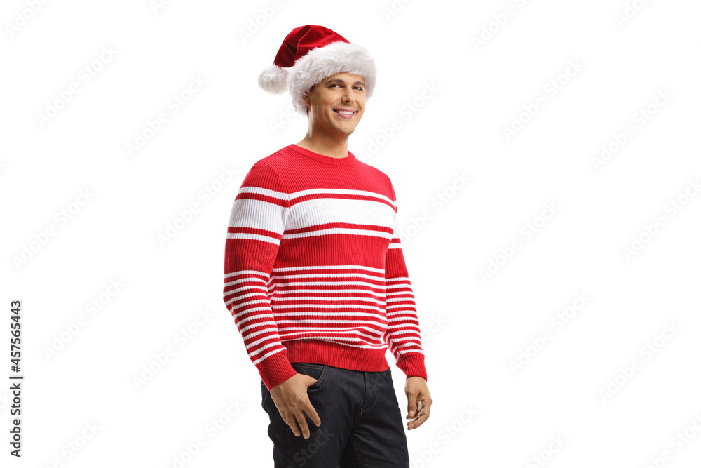 Young man wearing a christmas santa hat and a red sweater Young man wearing a christmas santa hat and a red sweater