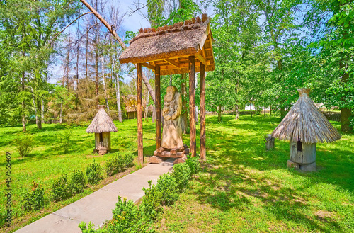 The wooden sculpture and log beehives, Pereiaslav Scansen, Ukraine photo