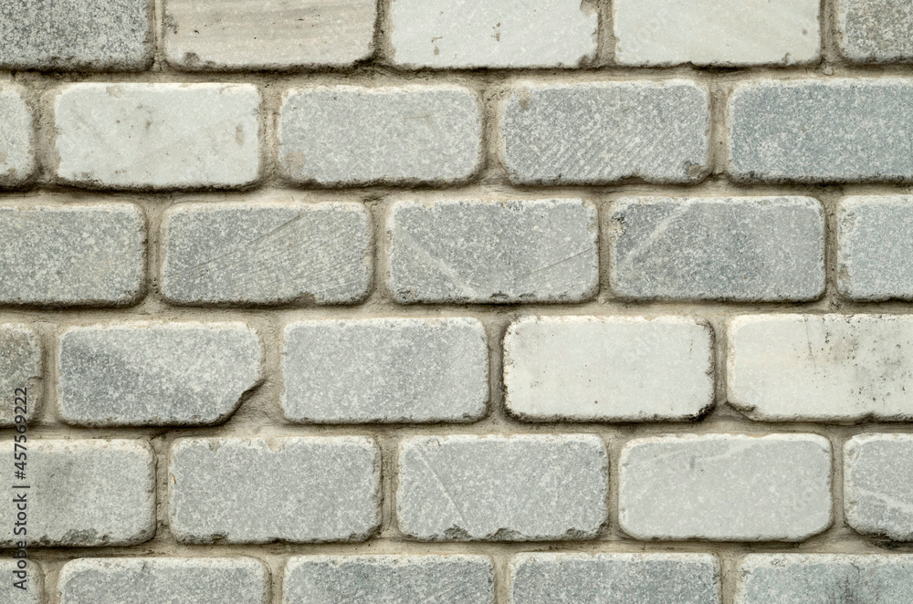 New light decorative marble bricks on wall close New light decorative marble bricks on wall close