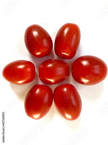 red cherry tomatoes isolated on white background