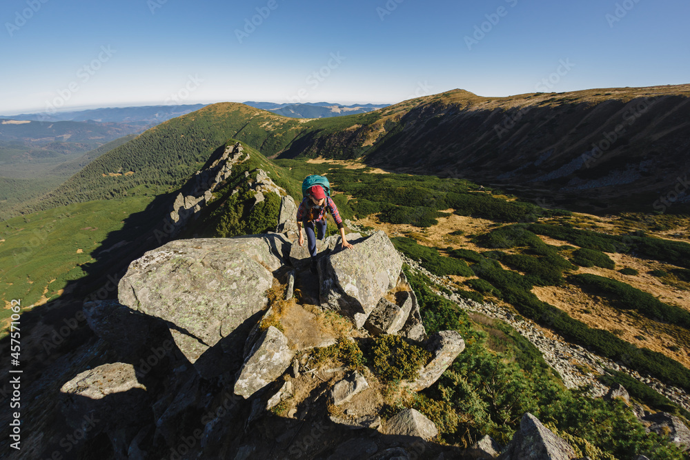 Aerial View of Hiker Woman on Top of a Mountain