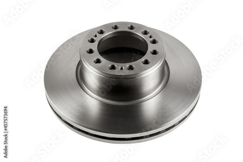 A new brake disc with a perfectly smooth surface isolated on a white background. Detail of a car brake system.