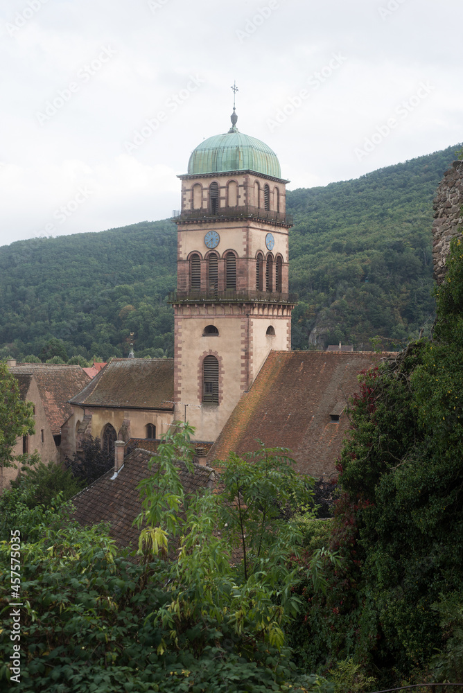 view of church bell tower in the famous alsatian village of Kaysersberg in France