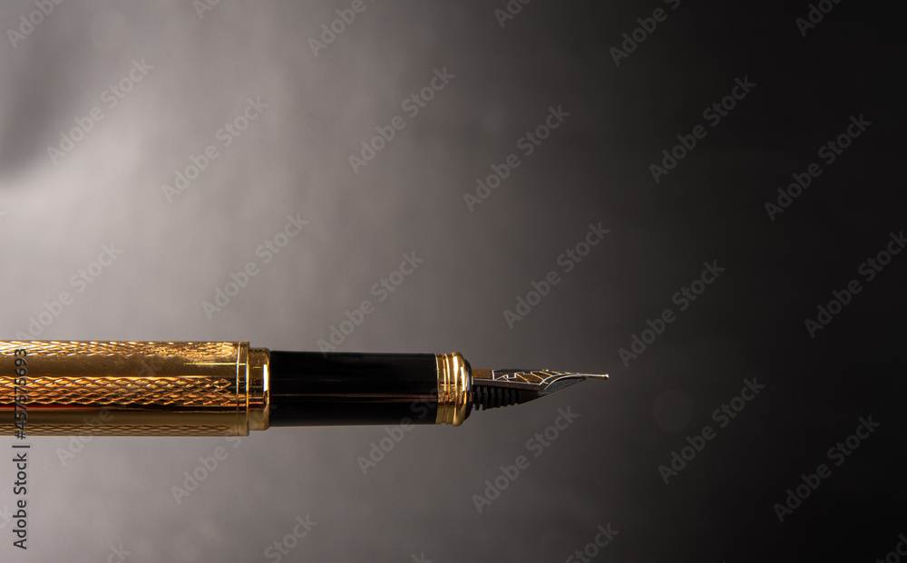 Fountain pen, beautiful details of a beautiful fountain pen, dark gradient background, selective focus. Fountain pen, beautiful details of a beautiful fountain pen, dark gradient background, selective focus.