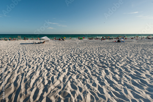 Big group of people enjoying the beautiful beach creative shot