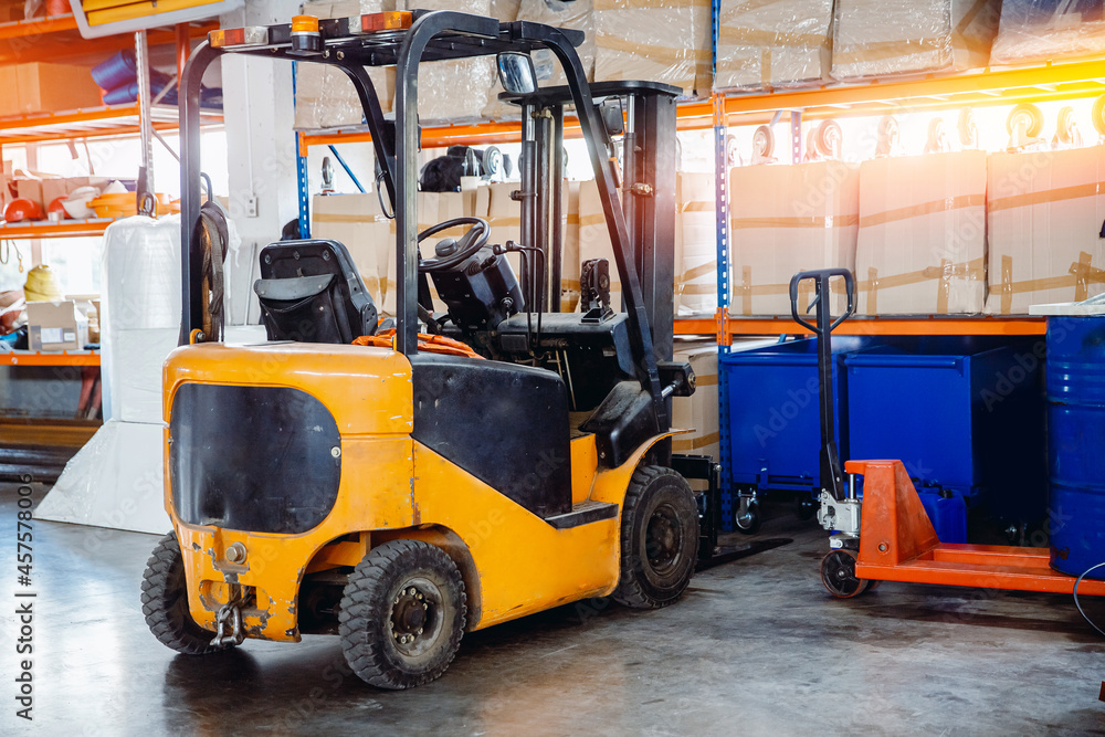 Industrial yellow forklift in warehouse Logistics store