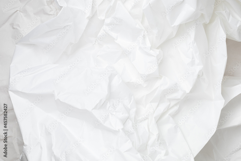 White crumpled wrapping paper background with texture and place for text White crumpled wrapping paper background with texture and place for text