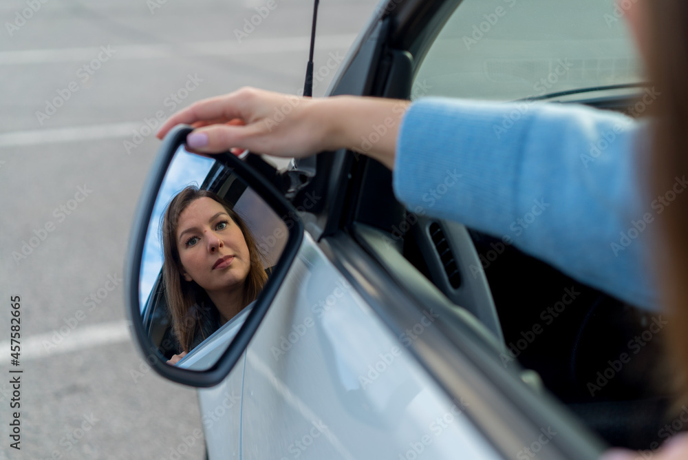 Broken off side rearview mirror on car. Driver is checking for damage on auto. Broken off side rearview mirror on car. Driver is checking for damage on auto.